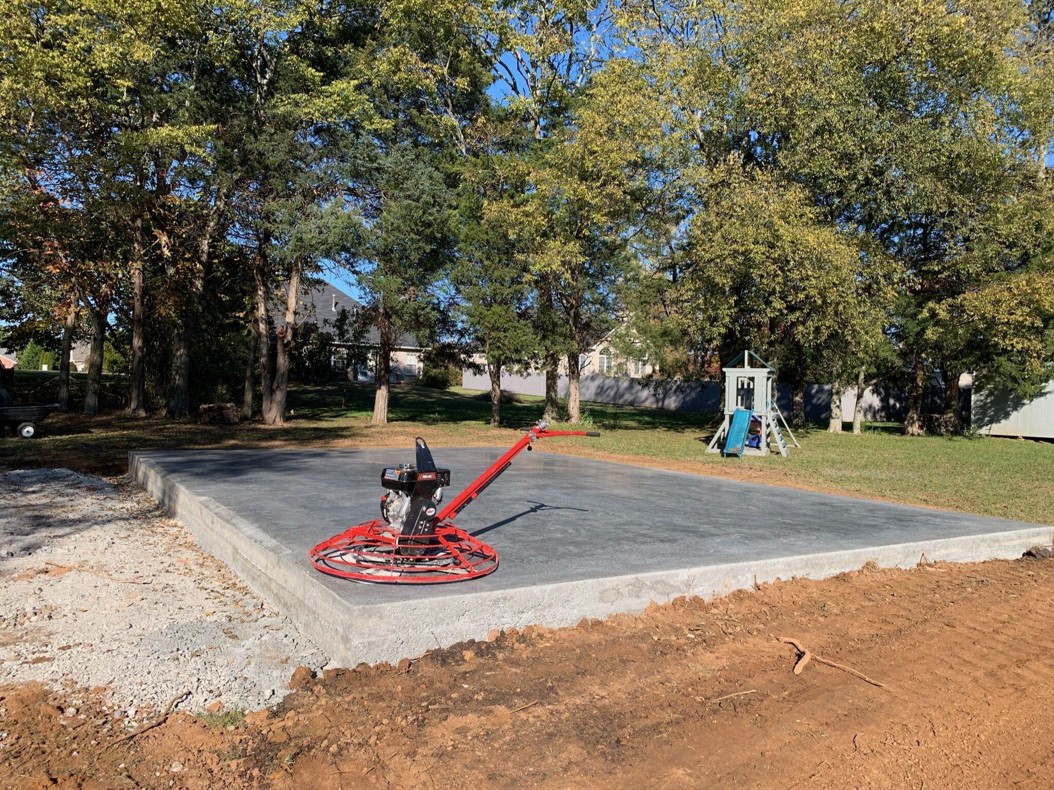 Freshly finished backyard concrete slab with power trowel — Complete Concrete TN