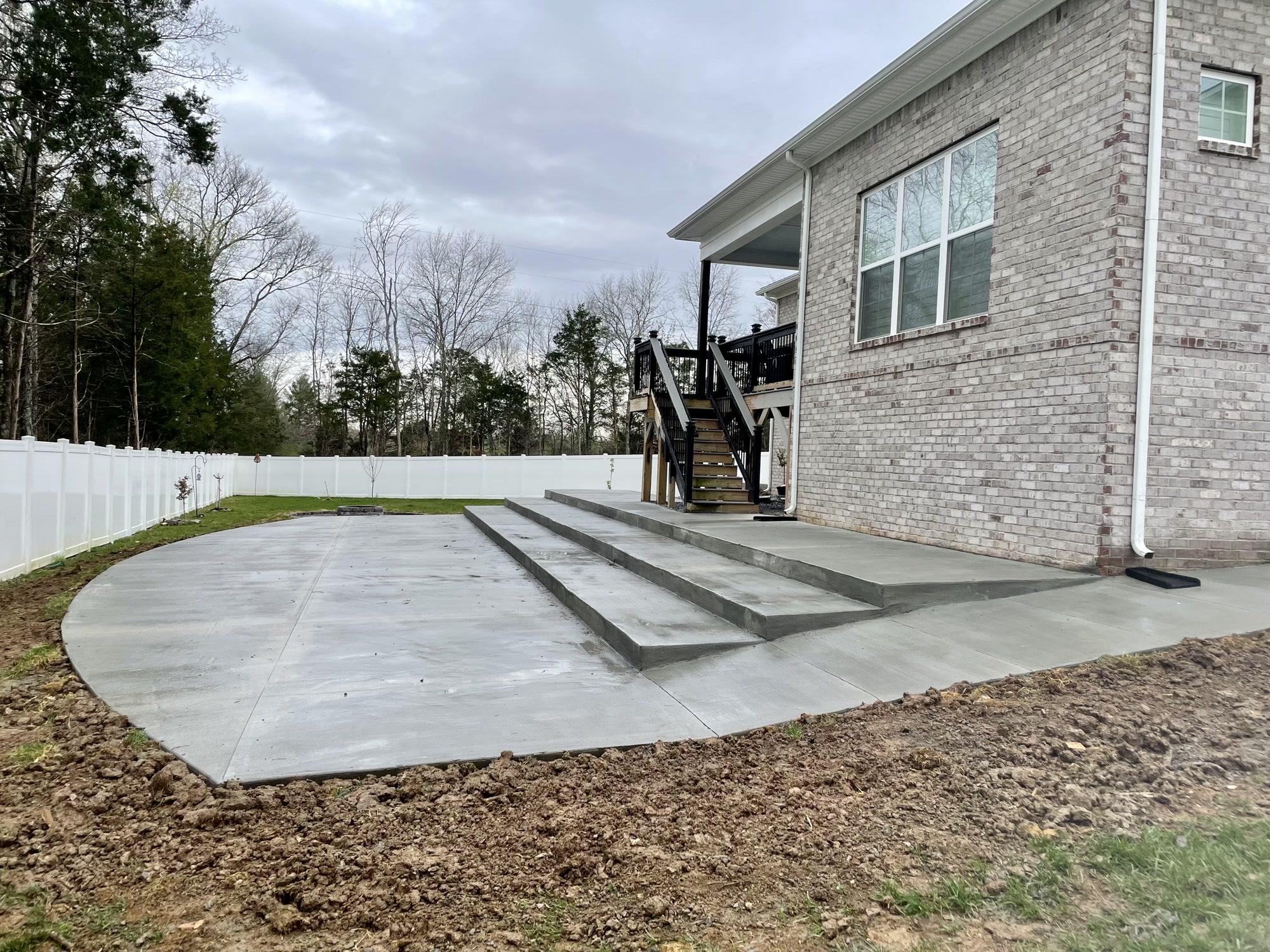 Backyard concrete patio with steps — Complete Concrete TN